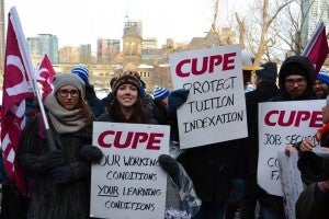 CUPE 3903 members holding picket signs in support of tuition indexation in March 2015.